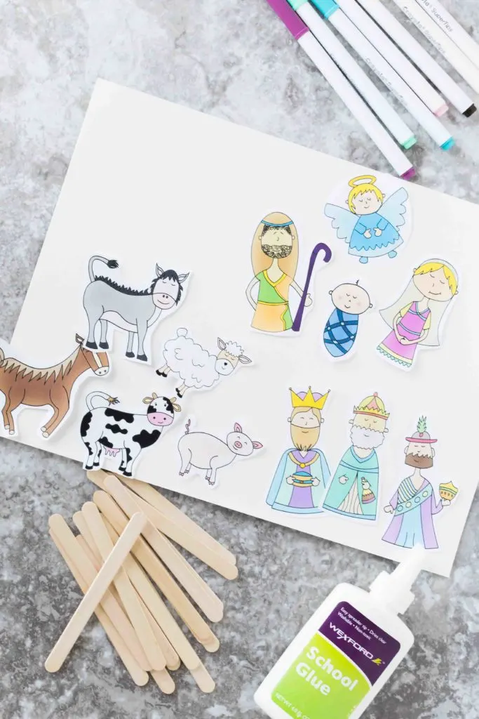 markers, Popsicle Sticks, glue and Cut out printables of the characters and animals in the Nativity Scene