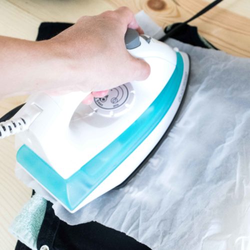 Pressing Iron On or HTV on a onesie with a regular household Iron