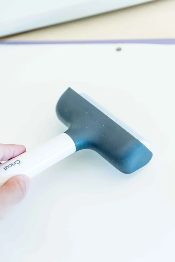 Use the brayer to secure paper