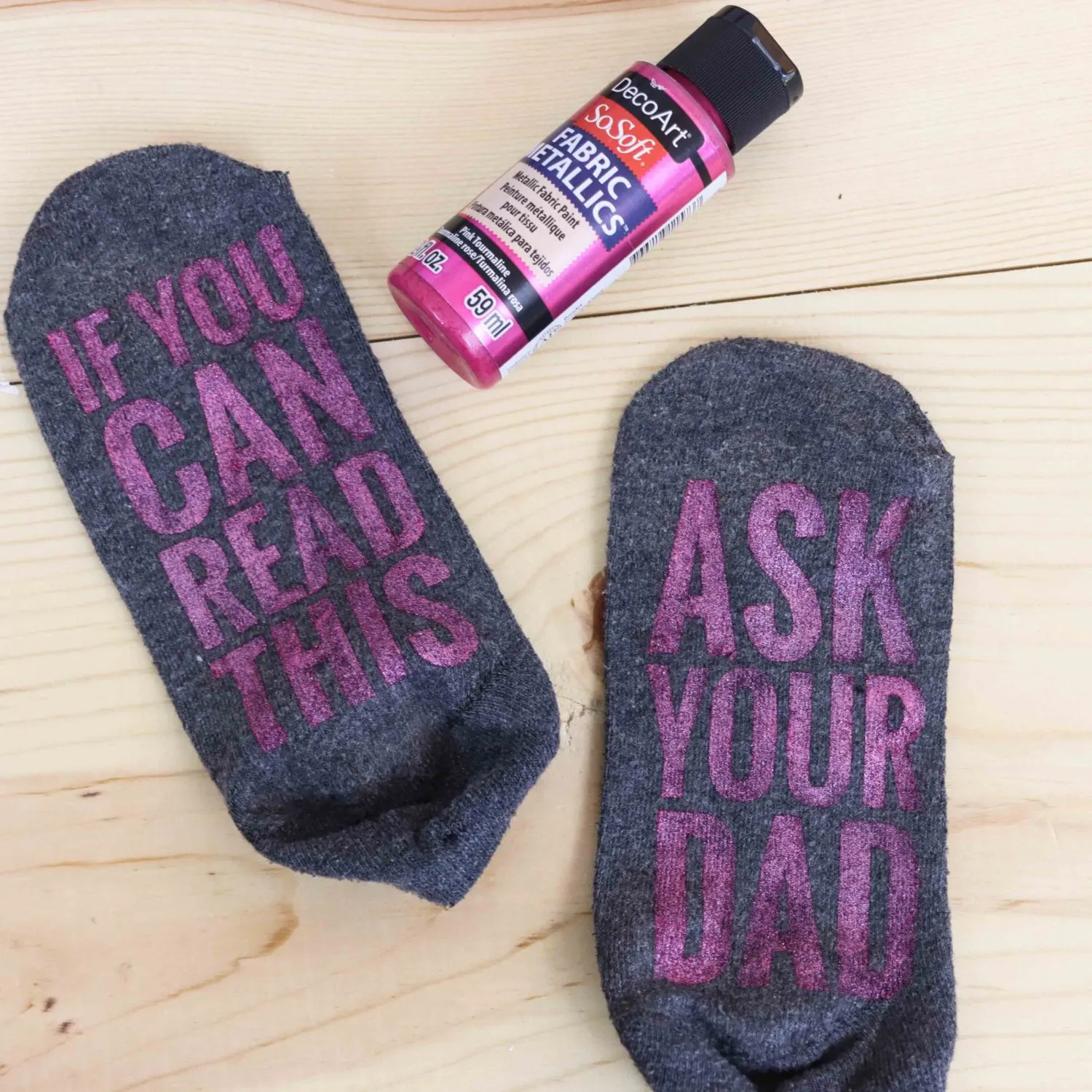 Grey Socks made with metallic fabric paint made with freezer paper and cricut