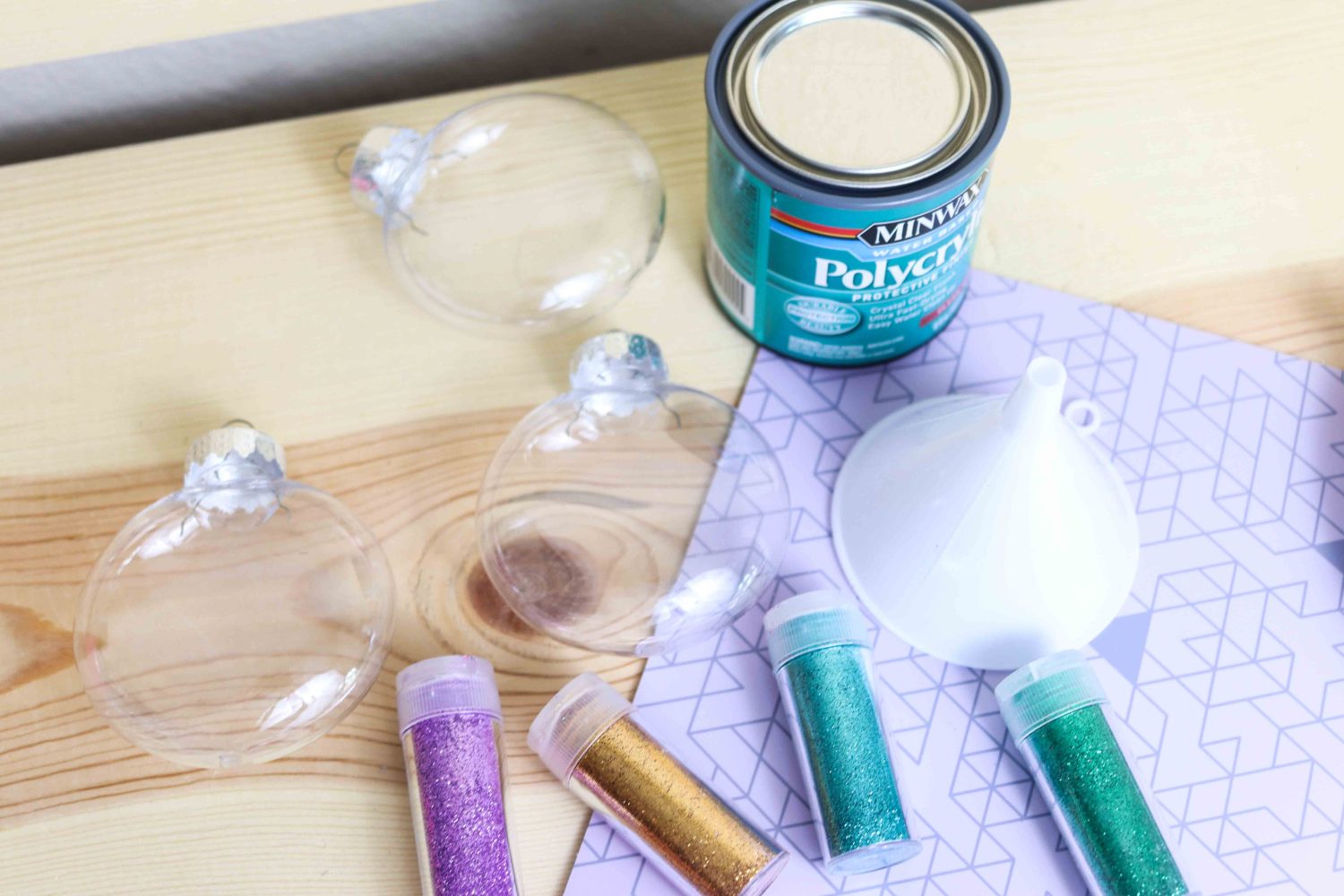 Materials needed to make glitter ornaments