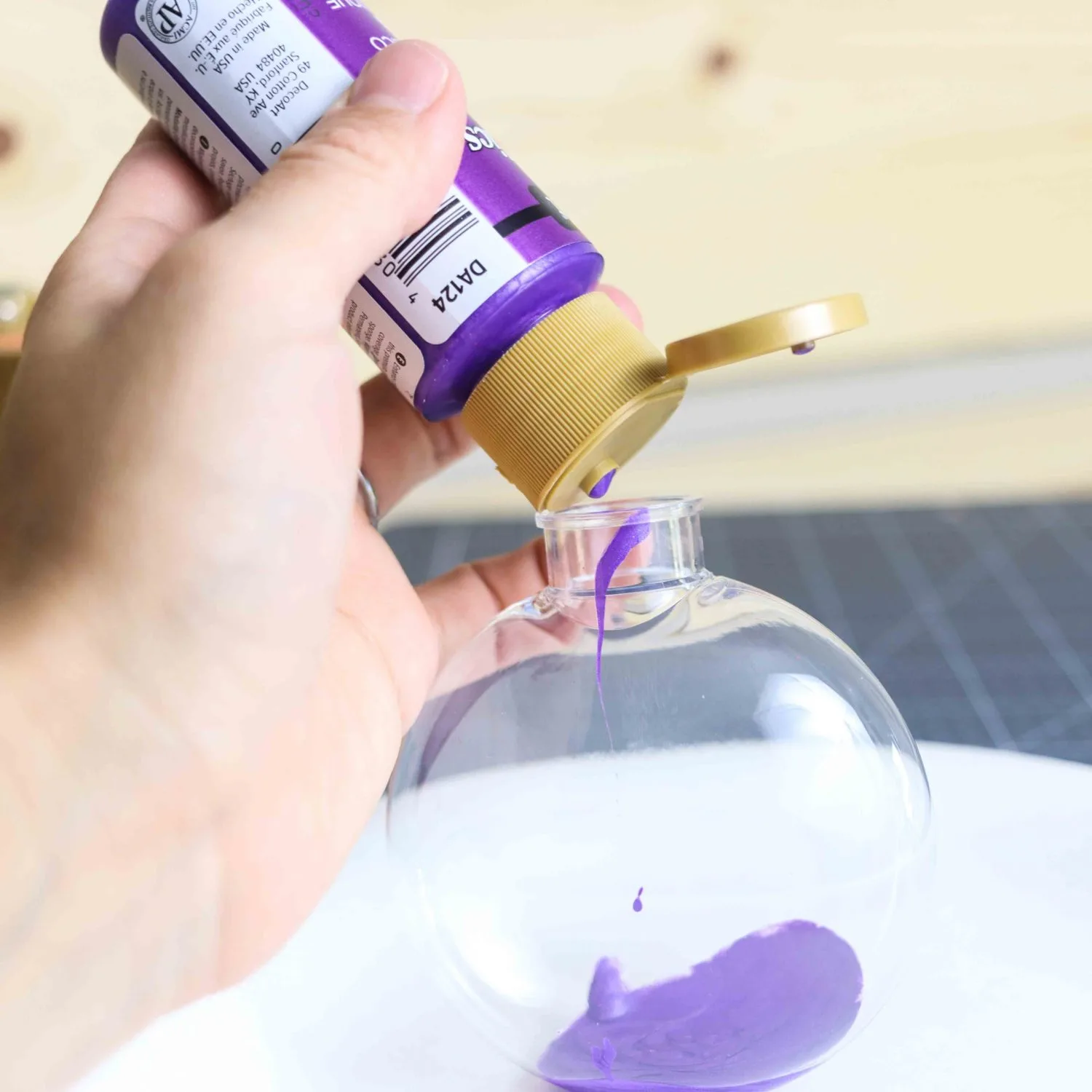 Pouring Paint in Christmas Ornament