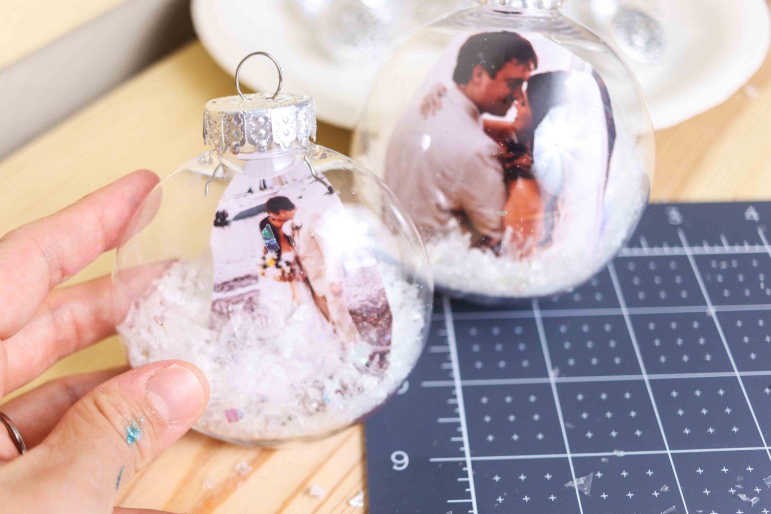 Two different Christmas Ornament made with photos and artificial snow