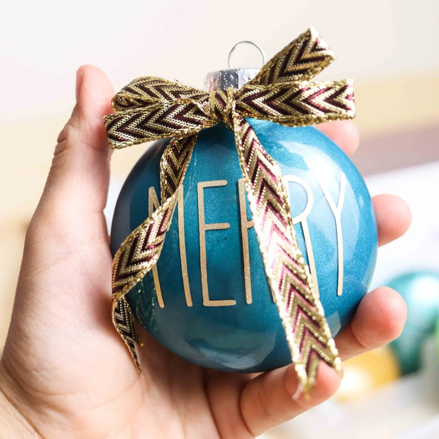 Christmas Ornament made with teal metallic pain and gold vinyl