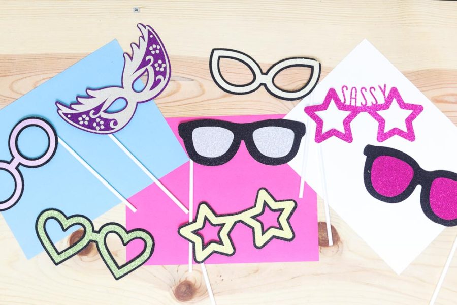 Asssorted colors and shapes of photo prop glasses made with a Cricut machine