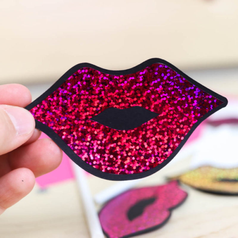 Photo booth Lips made with black cardstock and pink holographic sparkle iron-on.