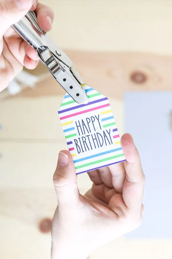 Using a punch hole to create an opening on a gift tag