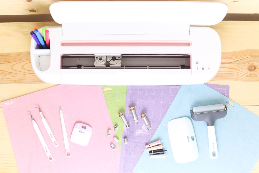 Cricut Maker with blades, mats and weeding tools.