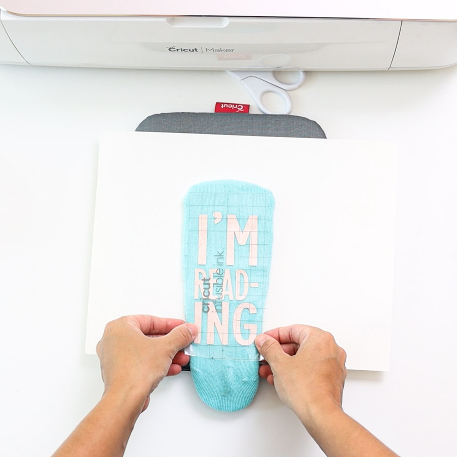 placing infusible ink transfer sheet on sock