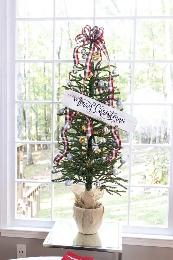 christmas tree with wooden sign