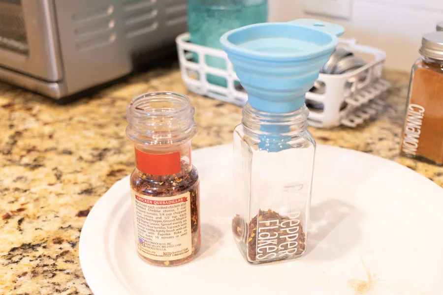 transferring spices using a funnel