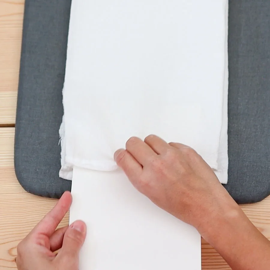 placing cardstock to prevent bleeding while painting kitchen towel