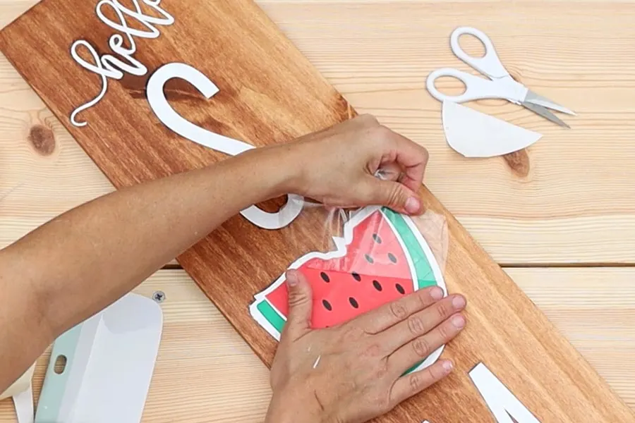 removing transfer tape from adhesive vinyl on wood