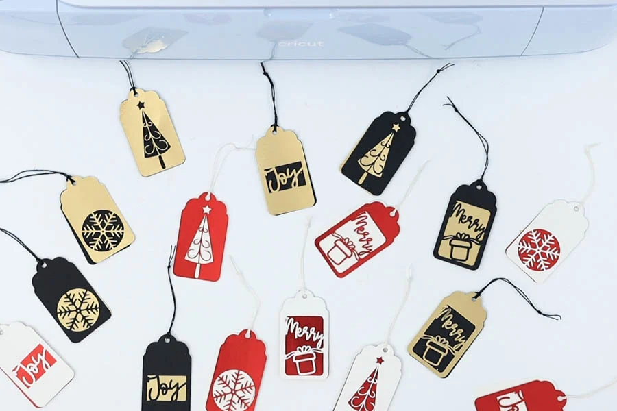 multiple christmas gift tags made with cricut machine