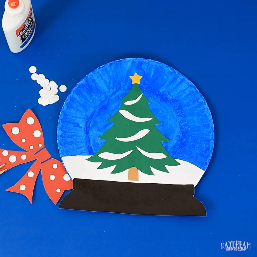 assembling christmas tree snow globe plate craft.