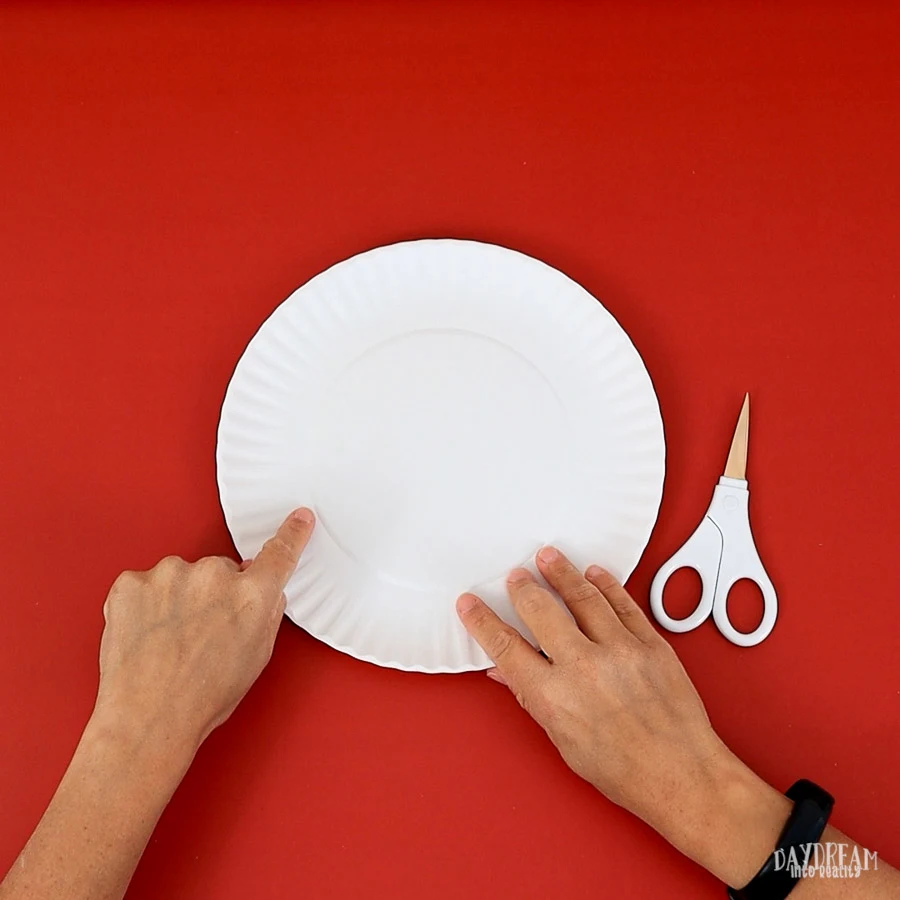 where to cut the paper plate to make a snowman