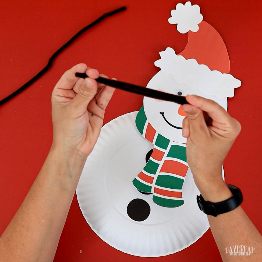 fold pipe cleaner to make snowman's arm