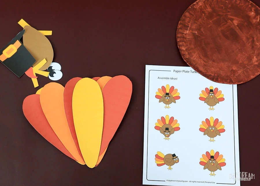 gather all the pieces to assemble paper plate turkey craft.