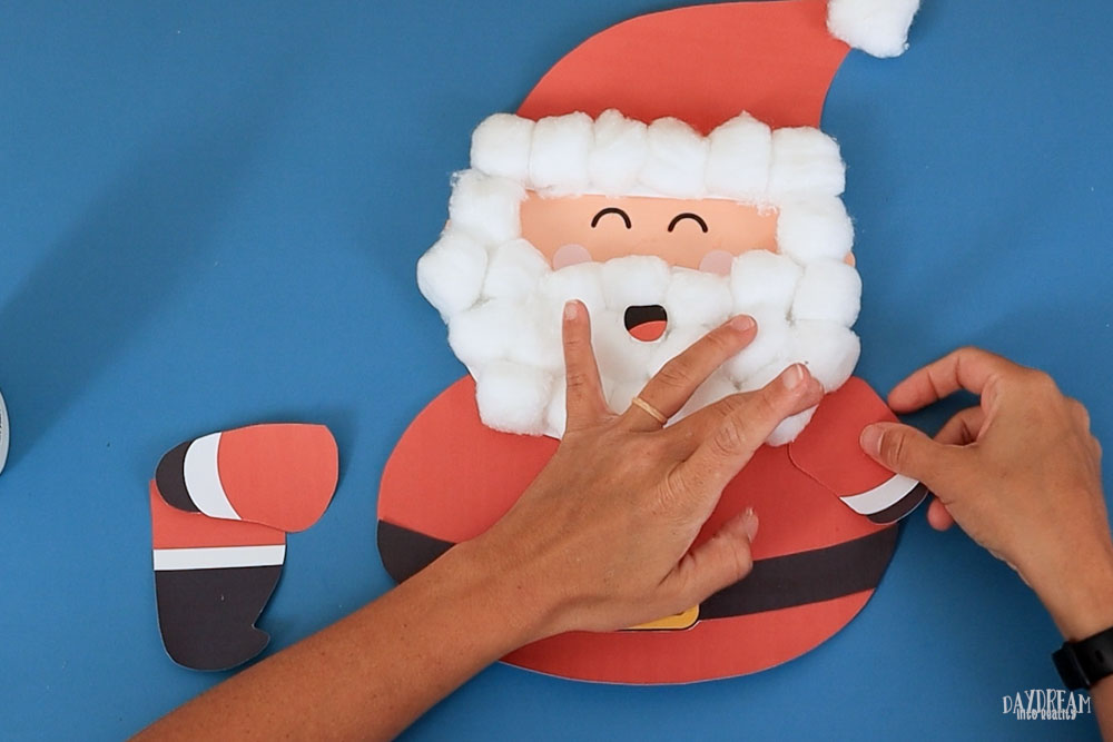 Glue arms to Santa