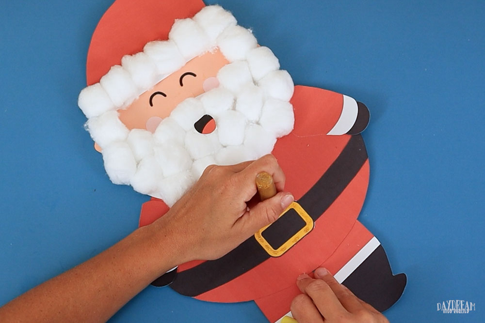 Add glitter glue to Santa's belt