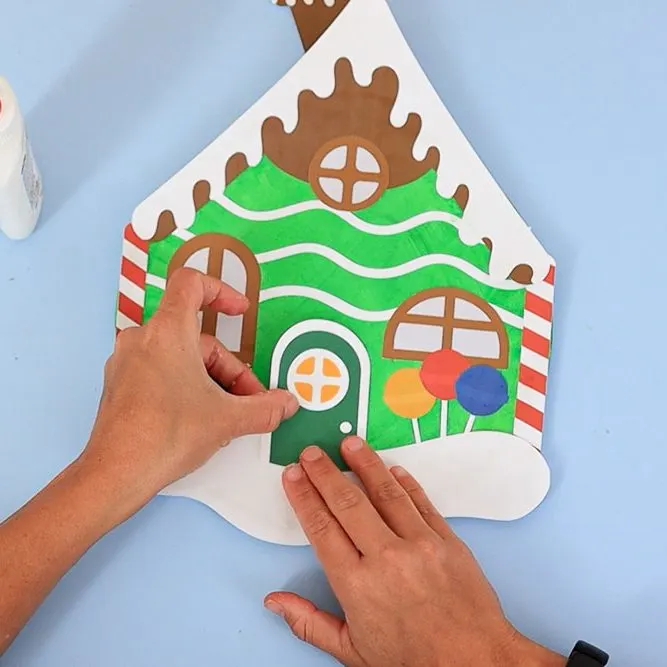 glue door on paper plate gingerbread house