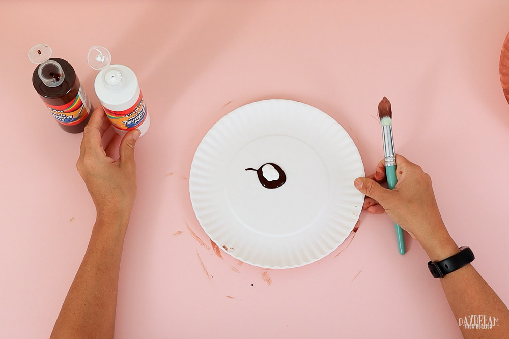 add white paint to paper plate