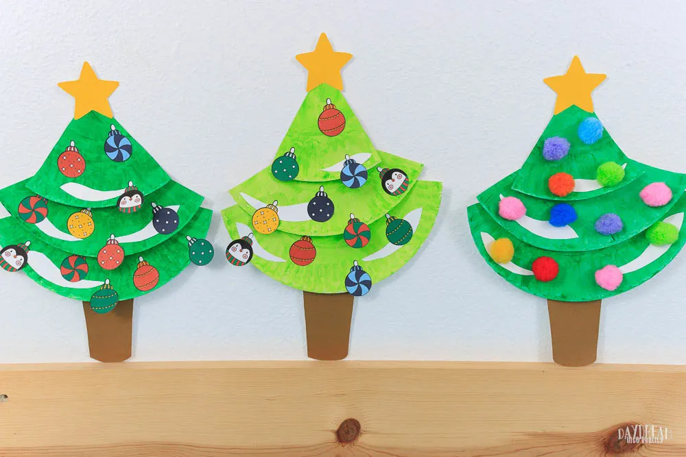 Different Christmas trees made with paper plates. Craft for Kids