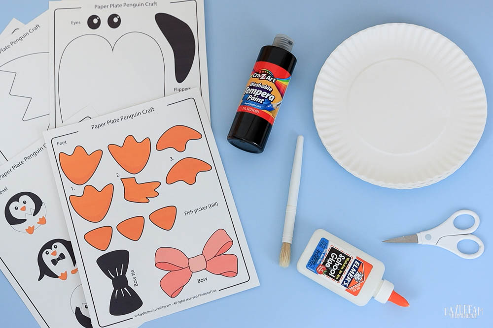 materials for making a penguin craft with paper plates